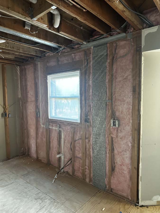 insulation being put into house's walls